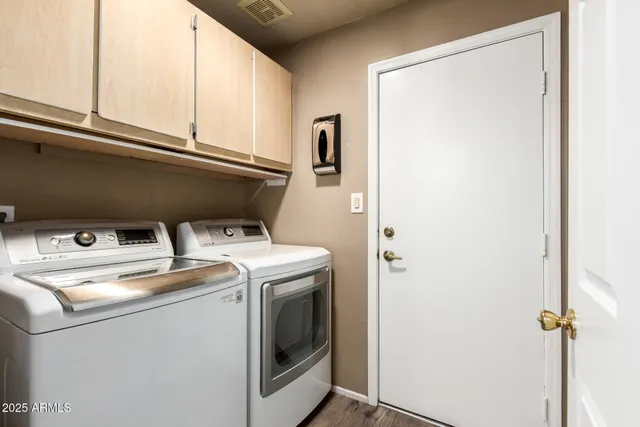 a utility room with dryer and washer