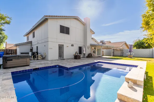 a view of a swimming pool with a lounge chair