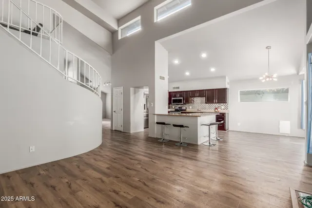 a view of kitchen with table and chairs