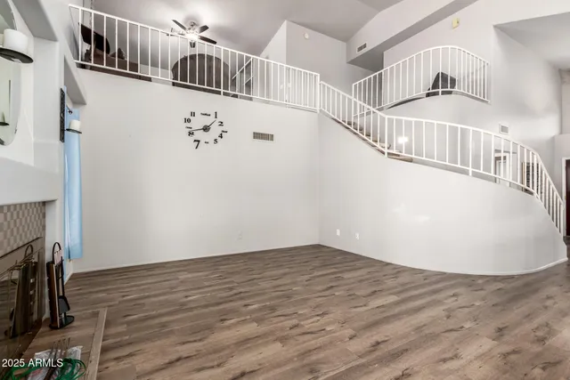 a view of an entryway with wooden floor