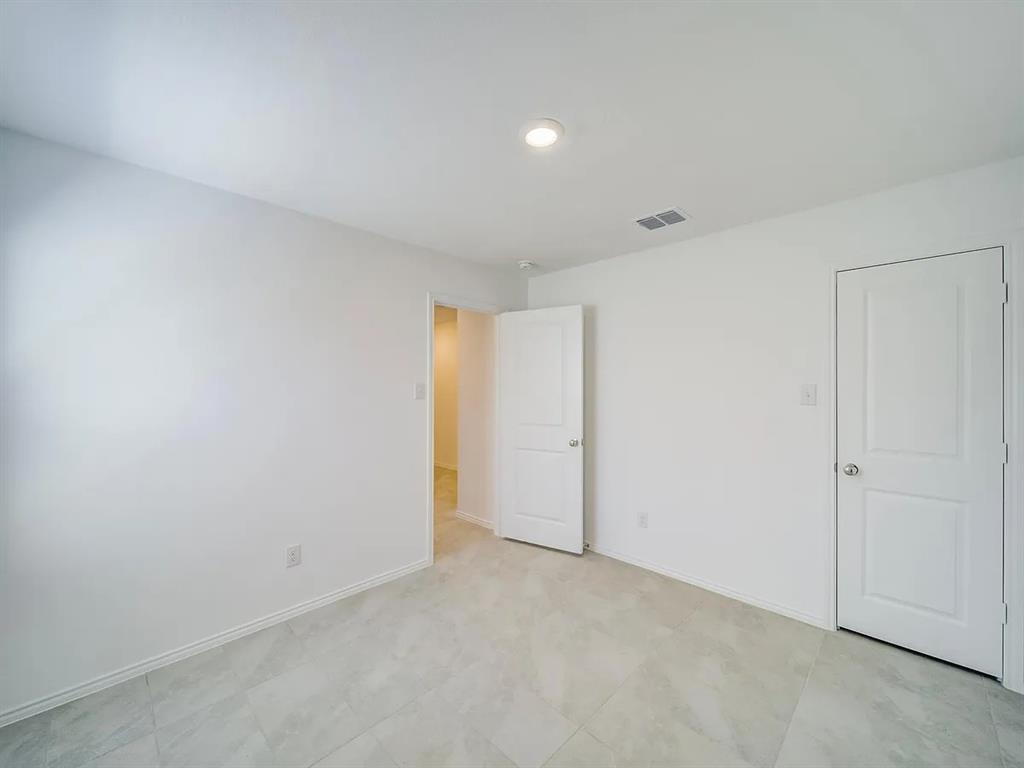 352 Sun Bluff Road Fort Worth, TX 76052 - Photo 19 of 33 Spacious room featuring light-toned tile flooring, recessed lighting, and white baseboards