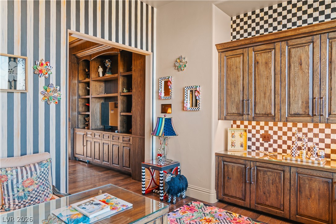 1123 Christian Road Henderson, NV 89002 - Photo 39 of 94 Rich hardwood built-ins provide ample storage in this vibrant, eclectic living space.