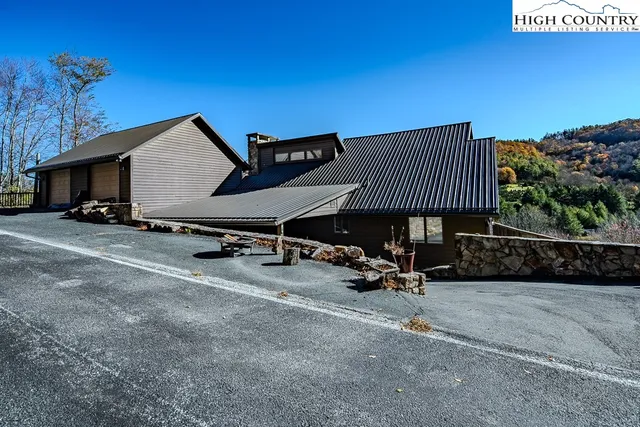 a front view of a house with parking area