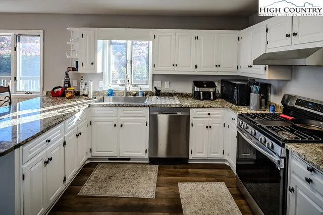 a bedroom with a bed couch and window