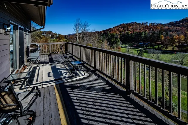a view of a balcony with wooden floor