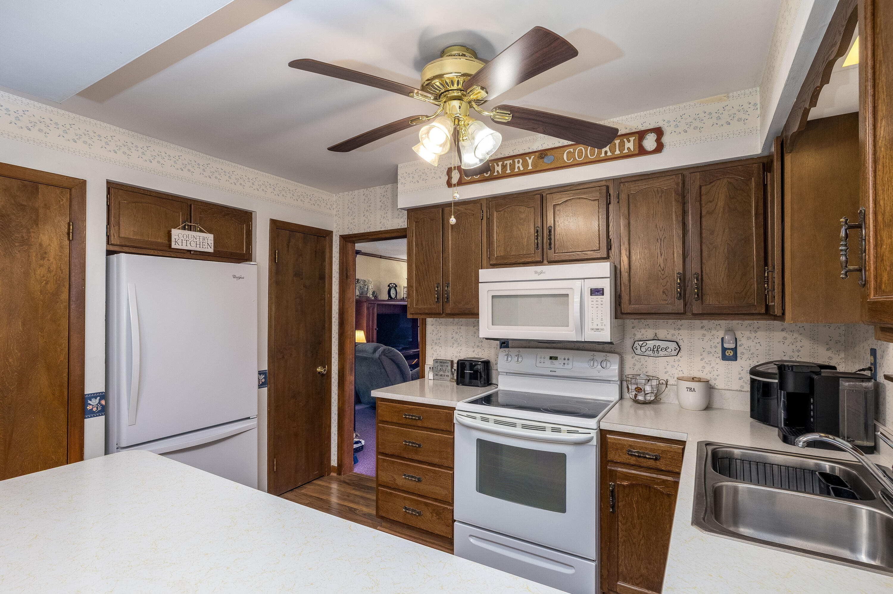 4674 Friar Tuck Circle Rensselaer, IN 47978 - Photo 12 of 47 a kitchen with a refrigerator a stove top oven a sink and dishwasher
