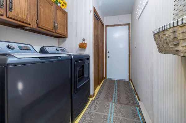 a utility room with dryer and washer