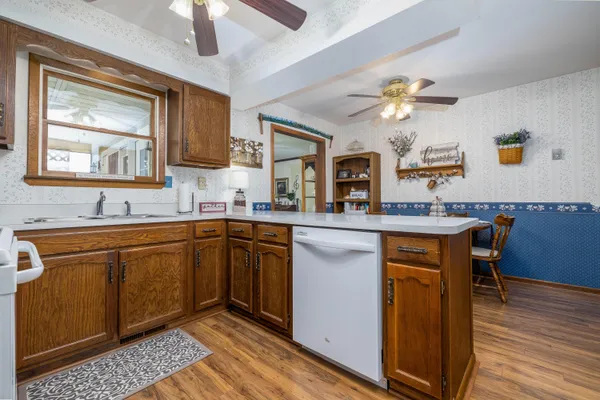 a kitchen with a sink cabinets and window