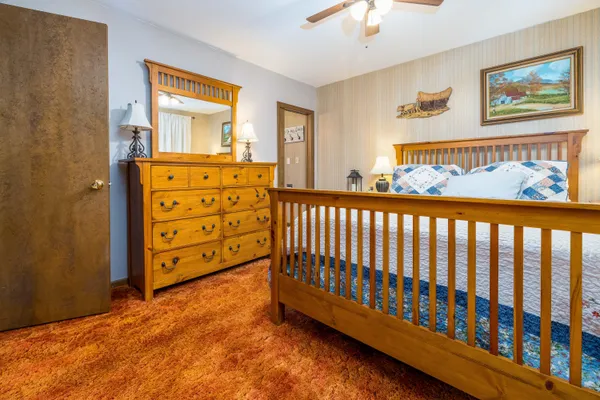 a bed room with a bed and a chandelier
