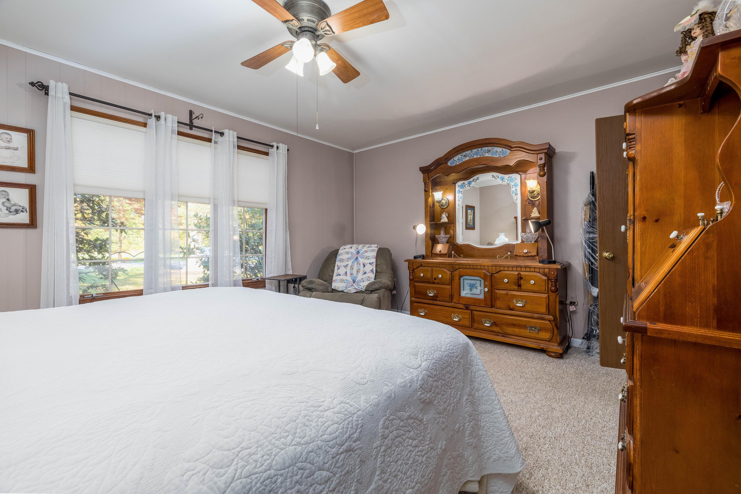 4674 Friar Tuck Circle Rensselaer, IN 47978 - Photo 32 of 47 a bedroom with a bed and a chandelier