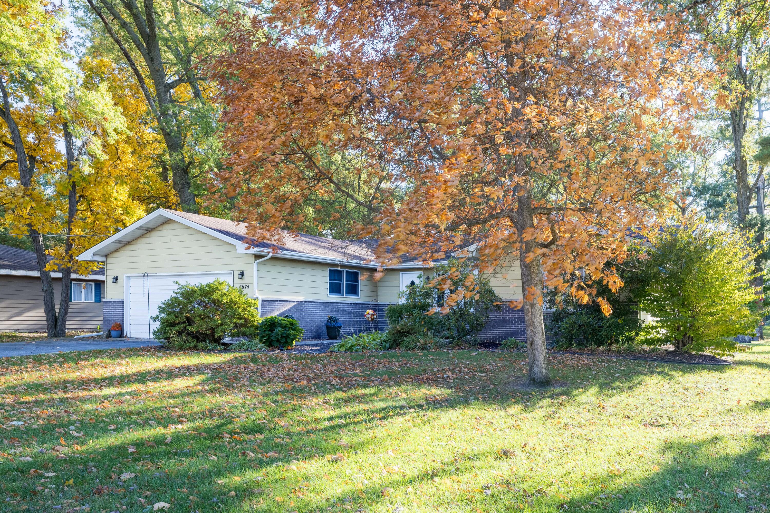 4674 Friar Tuck Circle Rensselaer, IN 47978 - Photo 35 of 47 a front view of house with yard and green space