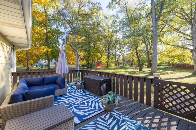 a view of a deck with furniture