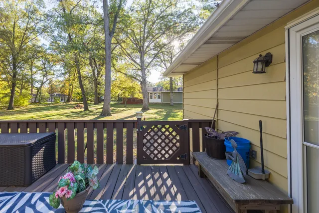 a view of balcony with wooden floor