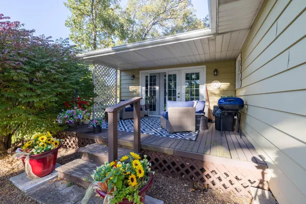 a view of a backyard with sitting area and furniture