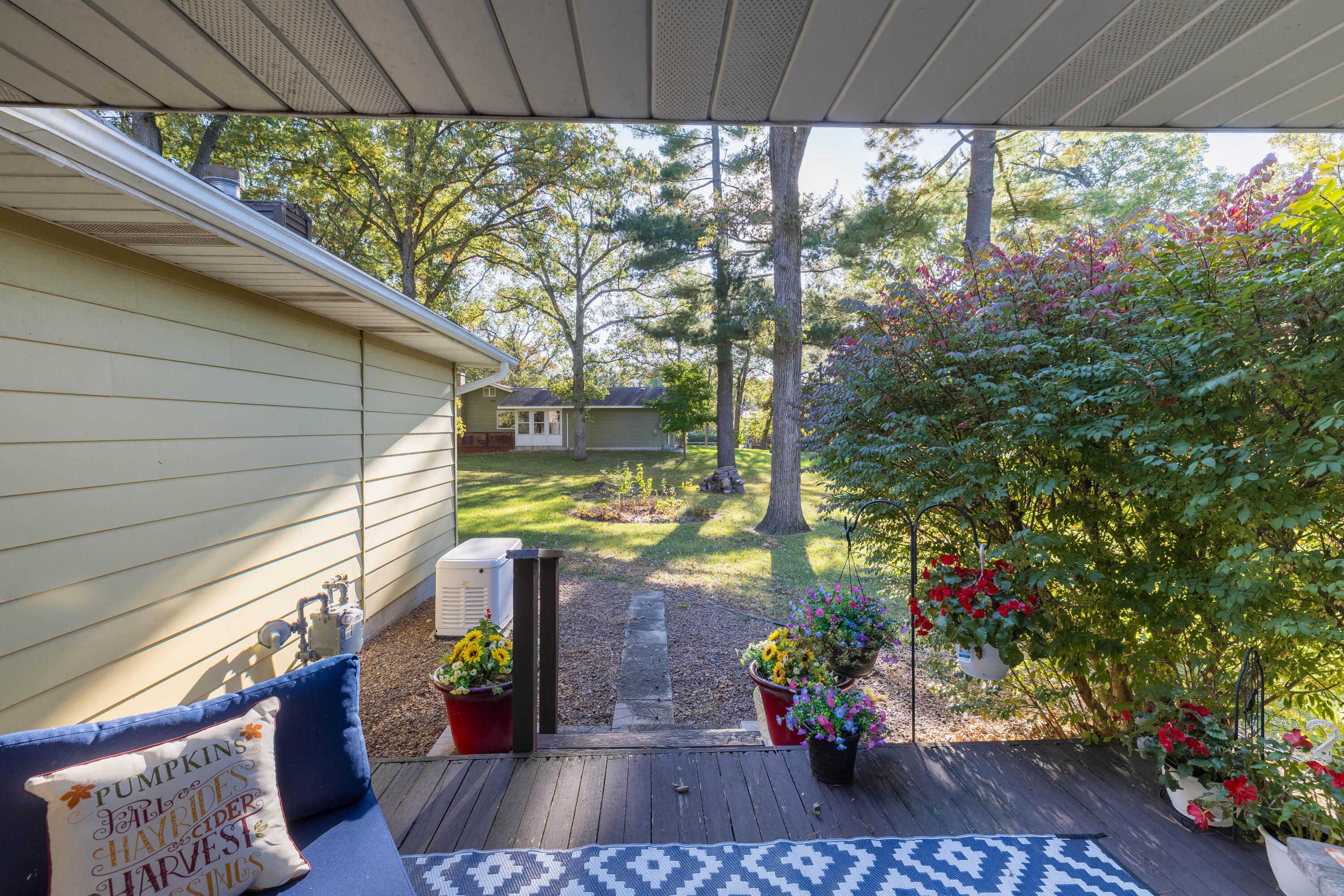 4674 Friar Tuck Circle Rensselaer, IN 47978 - Photo 45 of 47 a view of a balcony with chair and potted plants