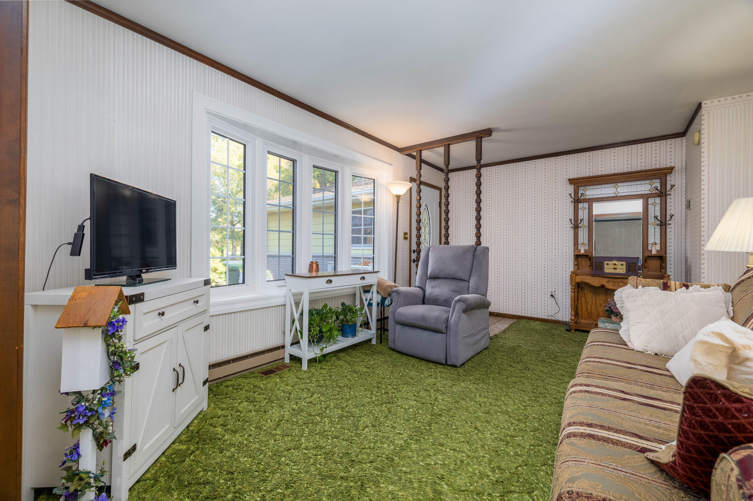 4674 Friar Tuck Circle Rensselaer, IN 47978 - Photo 5 of 47 a living room with furniture and a flat screen tv