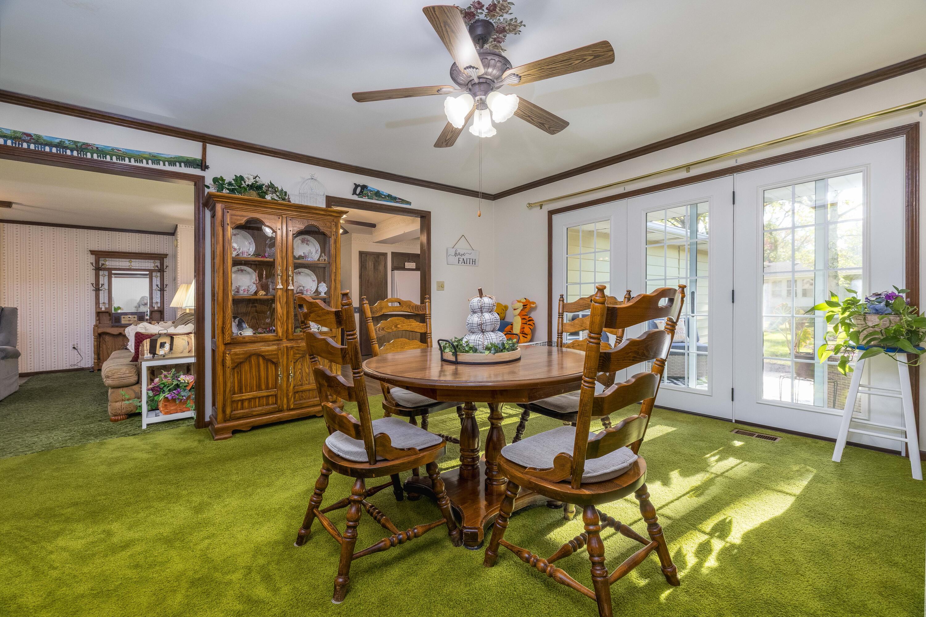 4674 Friar Tuck Circle Rensselaer, IN 47978 - Photo 9 of 47 a view of a dining room with furniture and a chandelier