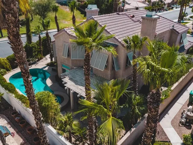 a view of a swimming pool with a yard