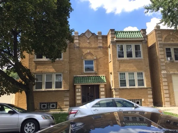 a front view of a house with parking space