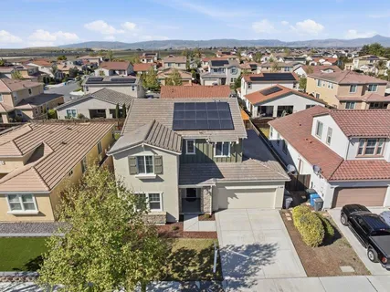 an aerial view of residential houses with outdoor space