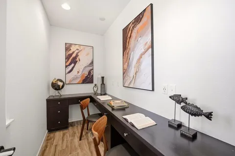 a view of a workspace with furniture