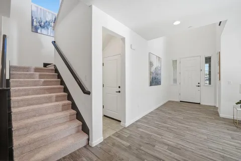 a view of an entryway with wooden floor