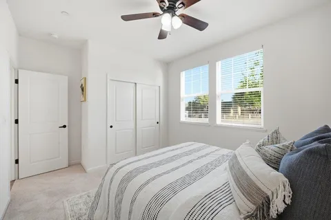 a bedroom with a bed and window
