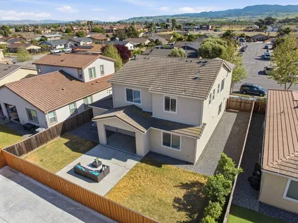 an aerial view of a house with a mountain view