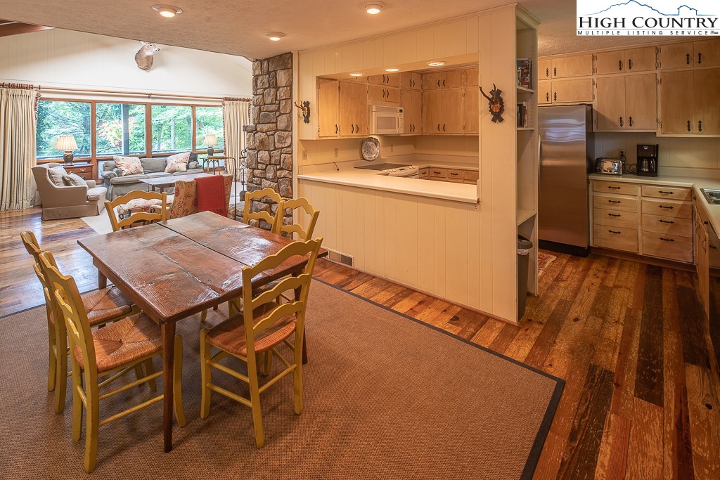 356 Balsam Road Boone, NC 28607 - Photo 13 of 37 a dining room with furniture and a large window