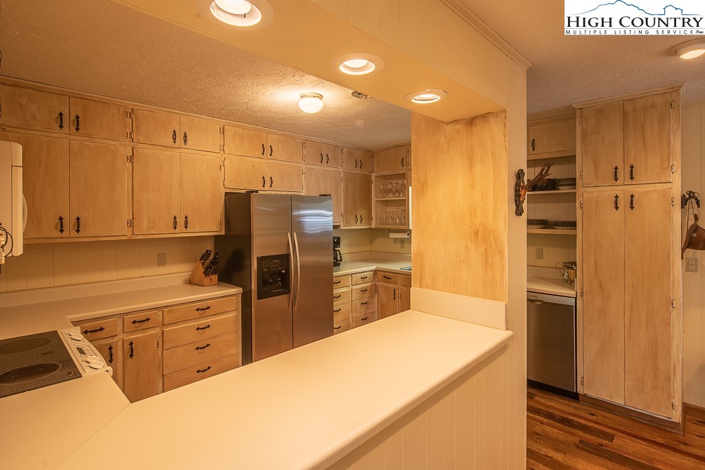 356 Balsam Road Boone, NC 28607 - Photo 14 of 37 a kitchen with stainless steel appliances a refrigerator and cabinets