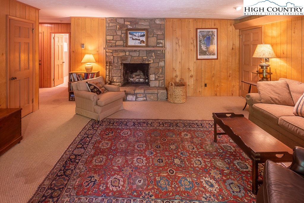 356 Balsam Road Boone, NC 28607 - Photo 22 of 37 a living room with furniture and a fireplace