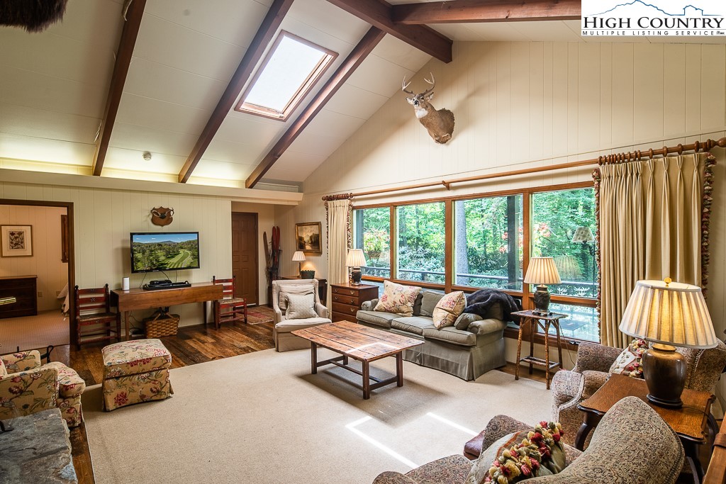 356 Balsam Road Boone, NC 28607 - Photo 29 of 37 a living room with furniture and a large window