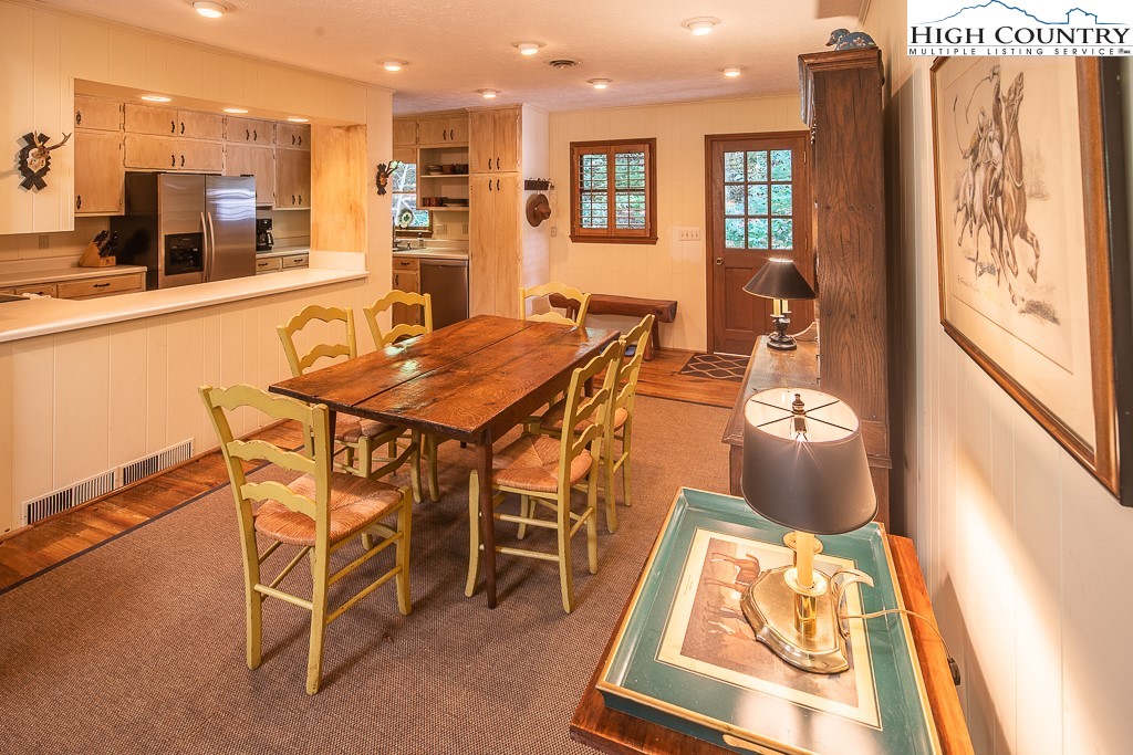 356 Balsam Road Boone, NC 28607 - Photo 30 of 37 a dining room with furniture and a floor to ceiling window