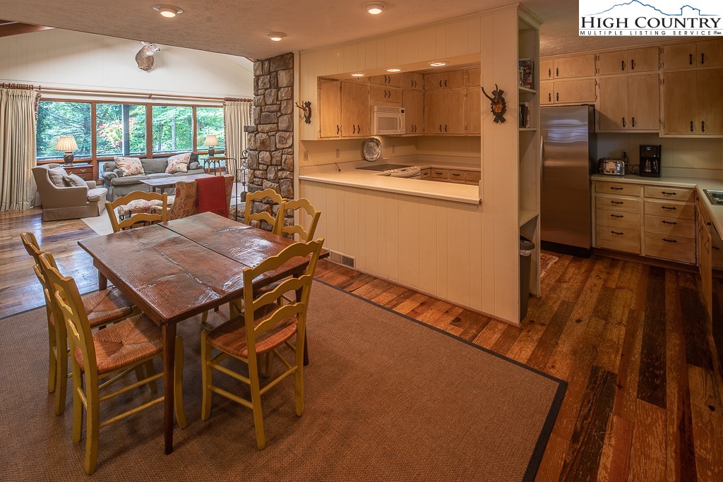 356 Balsam Road Boone, NC 28607 - Photo 32 of 37 a dining room with furniture and a large window