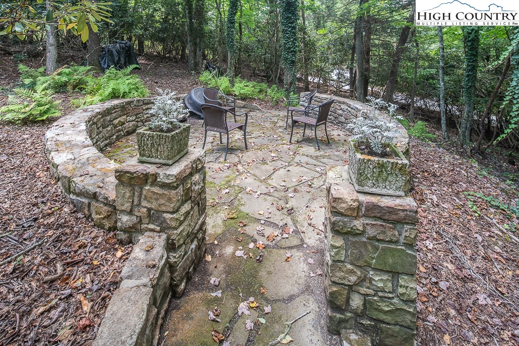 356 Balsam Road Boone, NC 28607 - Photo 35 of 37 a view of a chair and table in backyard