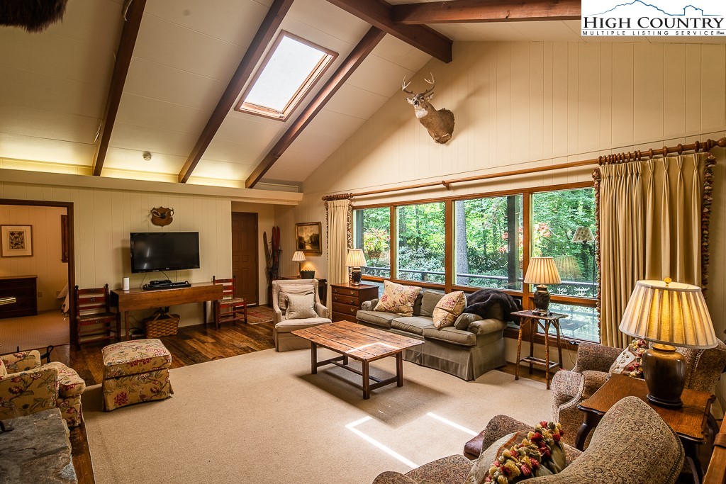 356 Balsam Road Boone, NC 28607 - Photo 4 of 37 a living room with furniture and large windows