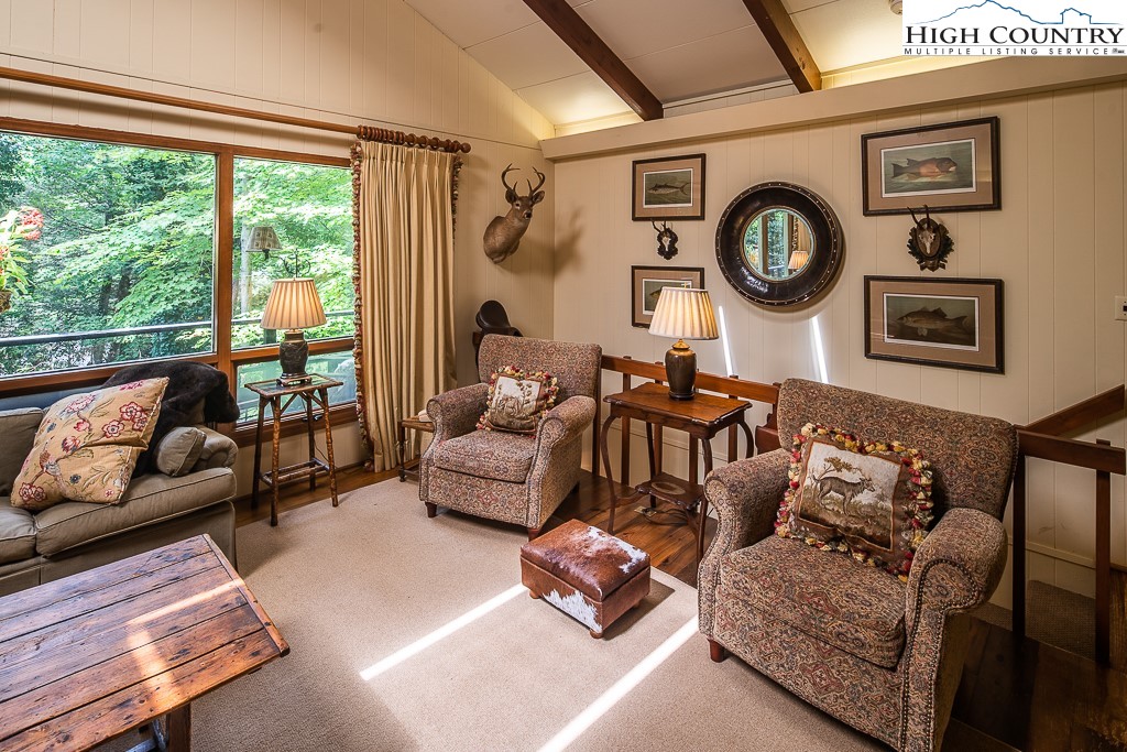 356 Balsam Road Boone, NC 28607 - Photo 6 of 37 a living room with furniture and a large window