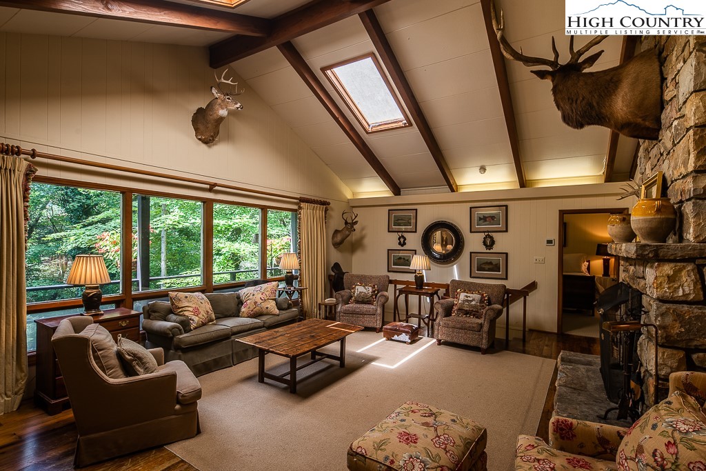 356 Balsam Road Boone, NC 28607 - Photo 7 of 37 a living room with furniture and a large window