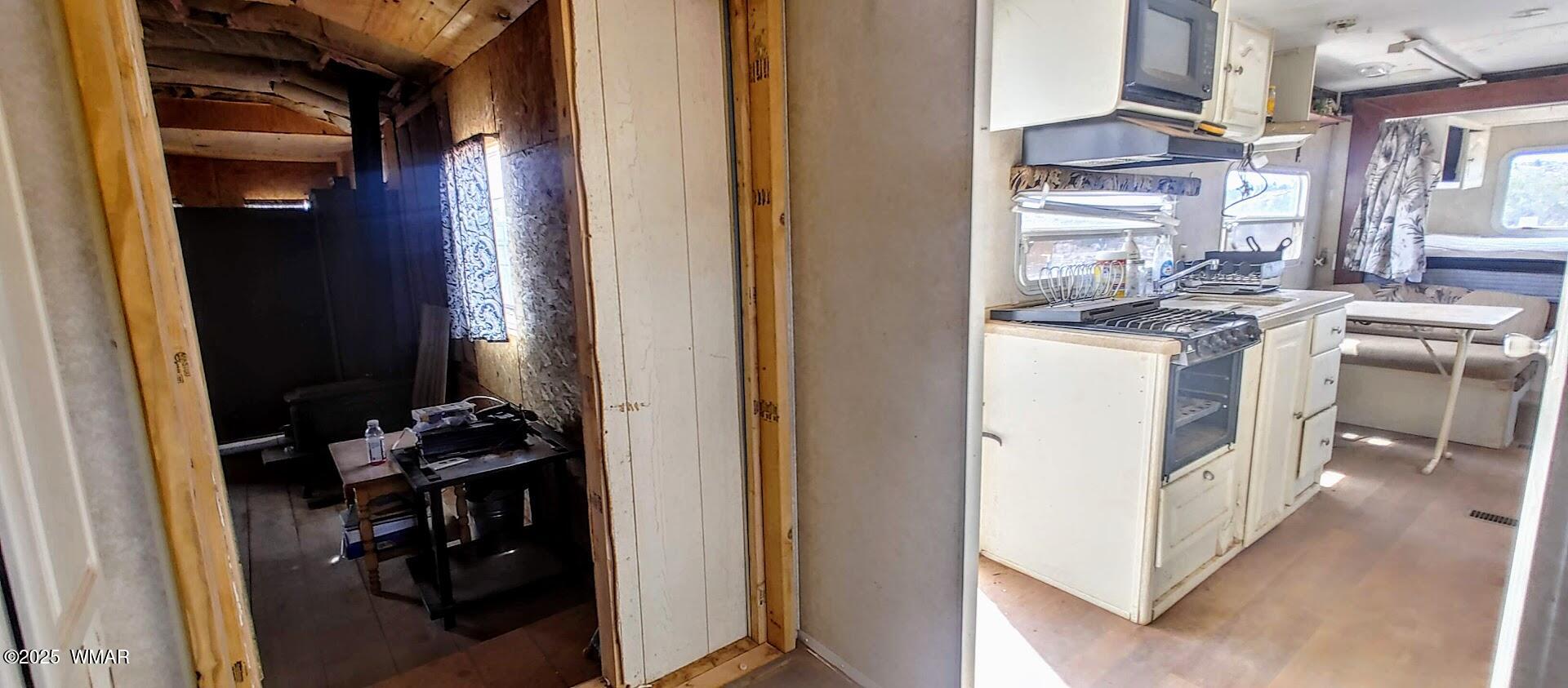 3219 El Capitan Road Show Low, AZ 85901 - Photo 7 of 13 a kitchen with a stove and a refrigerator