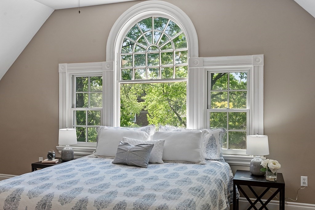 2 Gardner Road, Unit 3 Brookline, MA 02445 - Photo 15 of 32 a large bed sitting in a bedroom next to a window