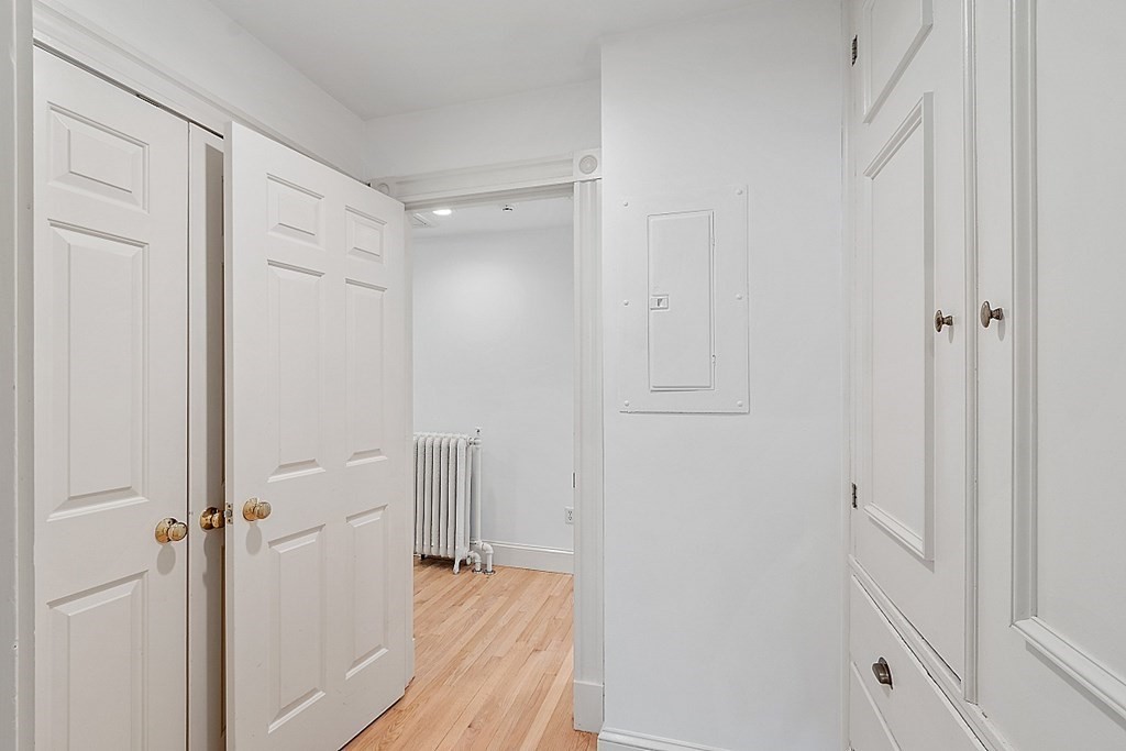 2 Gardner Road, Unit 3 Brookline, MA 02445 - Photo 17 of 32 a view of a hallway with wooden floor