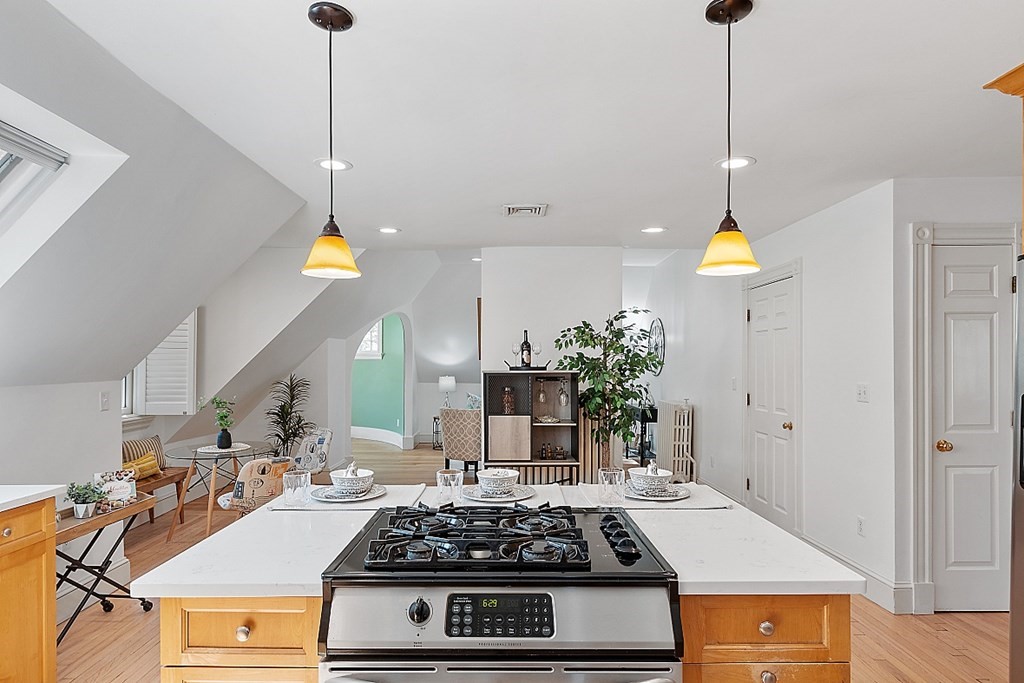 2 Gardner Road, Unit 3 Brookline, MA 02445 - Photo 3 of 32 a kitchen with a stove and a chandelier