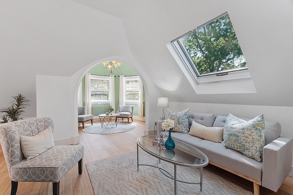 2 Gardner Road, Unit 3 Brookline, MA 02445 - Photo 8 of 32 a living room with furniture and a large window