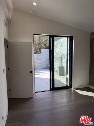 a bathroom with a shower and a sink