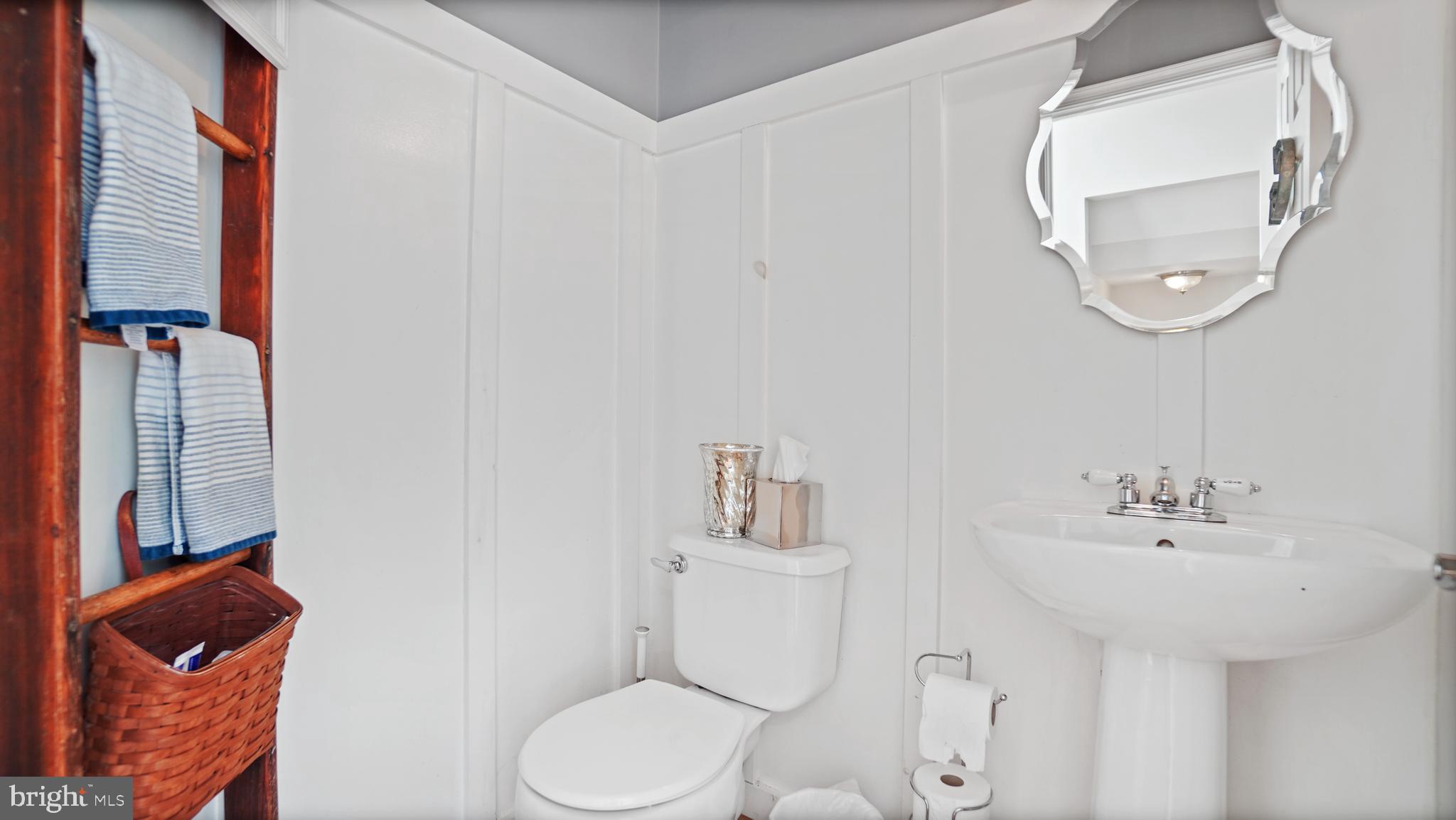 2801 Elsa Court Crofton, MD 21054 - Photo 21 of 58 a bathroom with a sink a toilet and a mirror