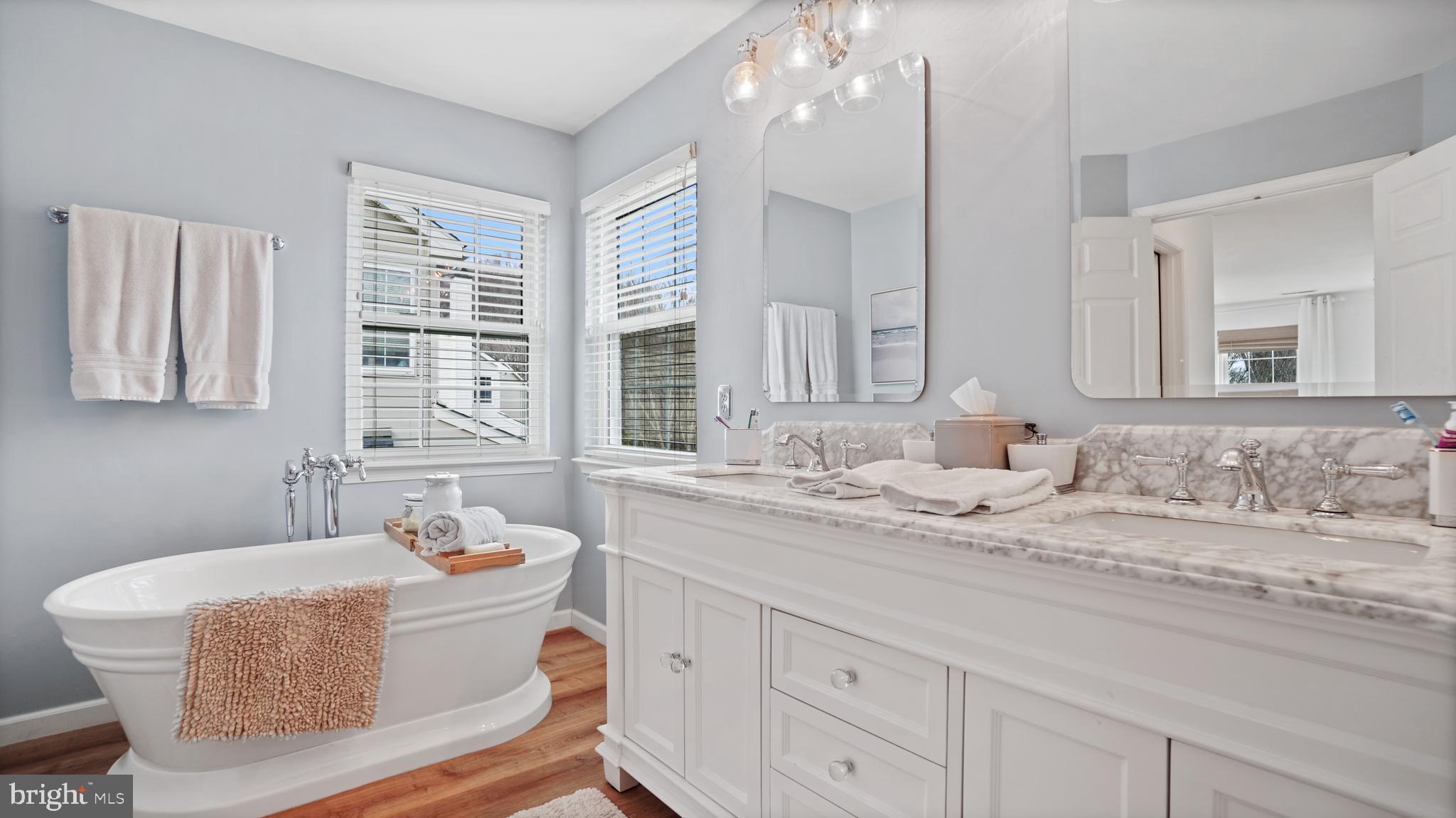 2801 Elsa Court Crofton, MD 21054 - Photo 30 of 58 a bathroom with a granite countertop sink mirror and a