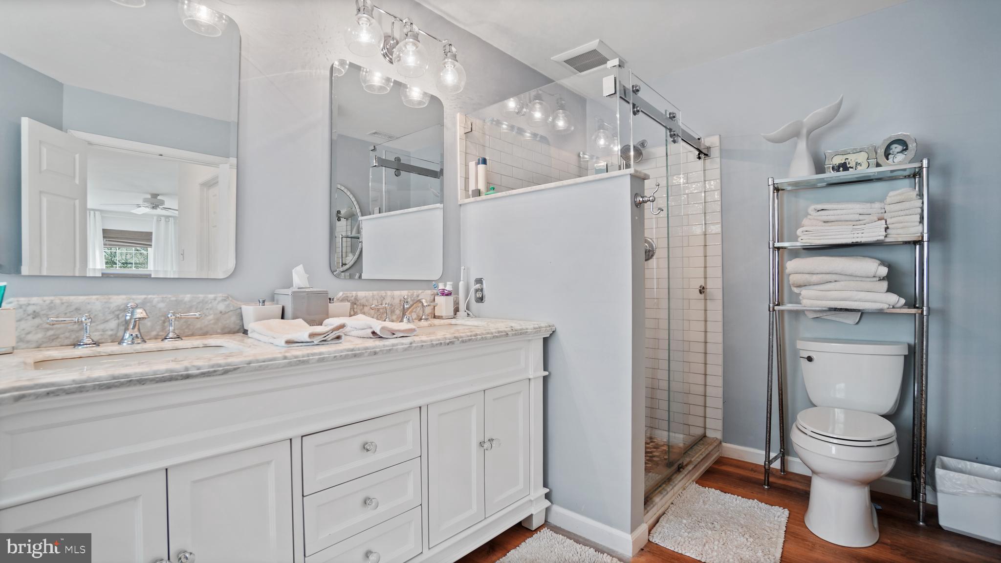 2801 Elsa Court Crofton, MD 21054 - Photo 31 of 58 a en suite bathroom with a granite countertop sink toilet and shower
