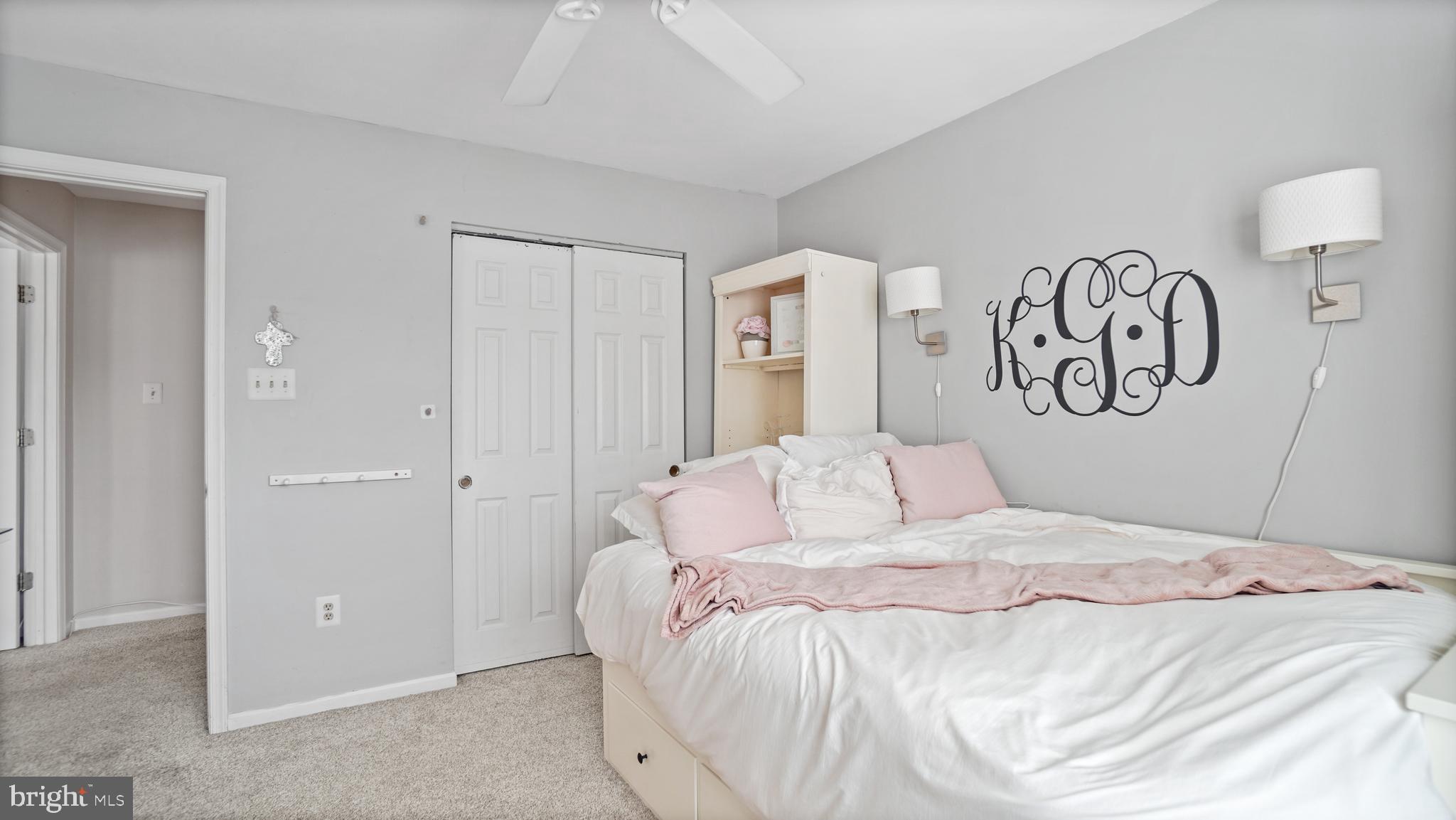 2801 Elsa Court Crofton, MD 21054 - Photo 34 of 58 a bedroom with a large bed and a chandelier