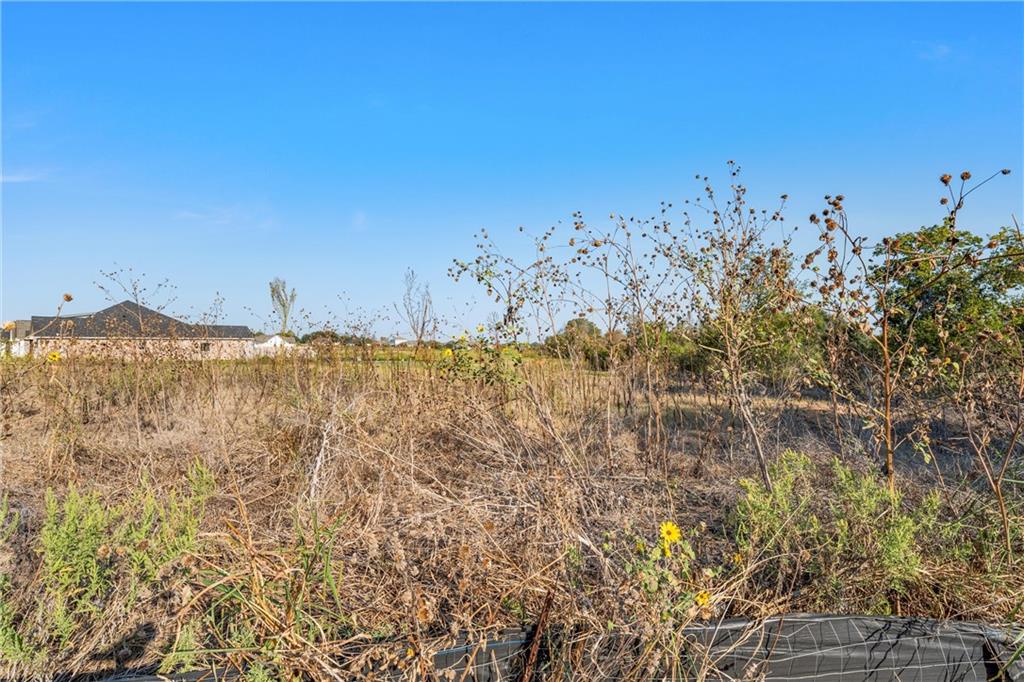 9801 Bridlewood Lane Waco, TX 76708 - Photo 3 of 10 a view of a large building with mountains in the background