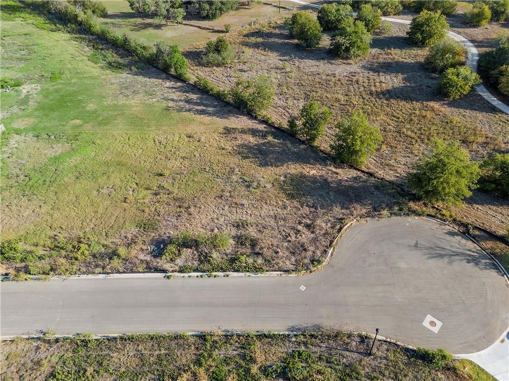 9801 Bridlewood Lane Waco, TX 76708 - Photo 9 of 10 a view of a road with a yard